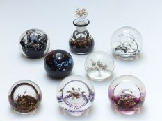 Seven Selkirk glass paperweights and an ink bottle, most limited editions with certificates