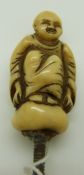 19th/20thC carved ivory seated Buddha with screw fitting by Ranele, possibly a parasol handle, H5cm