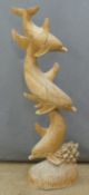 Wooden carving of three leaping dolphins, height 98cm
