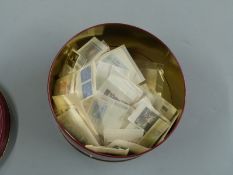 An extensive selection of Commonwealth QEII stamps in packets, mainly unmounted mint and including