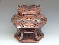 Chinese carved hardwood hexagonal stand with pierced decoration, undershelf and galleried top, H41