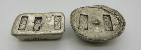 Two Chinese metal ingots/trade tokens