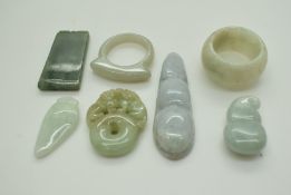 A small collection of jade items comprising two rings and four pendants