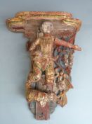 A 19thC giltwood and jewelled figural wall bracket, possibly a temple piece, H33cm