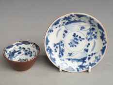 An 18thC Chinese blue and white tea bowl and saucer
