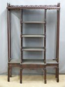 A four tier breakfront whatnot with galleried top, possibly Eastern / Chinese, W101 x D34 x H135cm