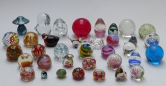 Thirty-five glass paperweights including Caithness, Alum Bay, etc.