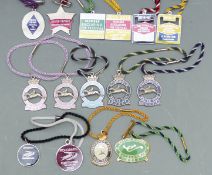 Fifteen enamel horse racing member's badges including Cheltenham 2005-6, 2006-7, 2012-13, 2013-14,