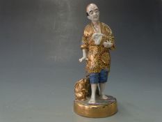 Early 20thC Japanese figure of man with rabbits, H18cm