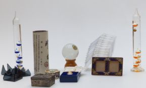 Two glass thermometers, vase, crystal ball on stand, Halcyon Days egg, paperweight stands etc