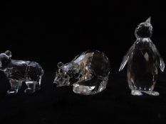 Three Swarovski Crystal cut glass animals comprising Penguin, Polar Bear 7649 and Grizzly Cub