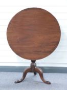 Georgian mahogany tilt top occasional table raised on tripod base with single piece top and bird