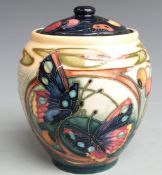 Moorcroft covered vase decorated with flowers, fruit and insects, dated 2002, H15cm