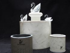 Three Swarovski Crystal cut glass swans including two Collector's Society editions, all in