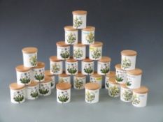 Thirty Portmeirion spice/herb/storage jars with wooden covers decorated in Botanic Garden pattern,