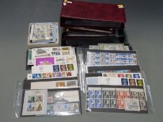 A good range of GB QEII stamps including high value definitive sets in presentation packs, first day