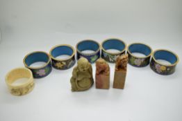 Six Chinese cloisonné napkin rings, soapstone sealwith Buddaha finial, engraved Japanese napkin