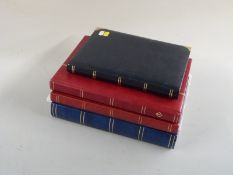 A stockbook of GB Machin cylinder blocks, a stockbook of coil leaders and regional issues, a