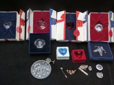 A collection of Swarovski Crystal cut glass items including paperweights, Crystal Memories,