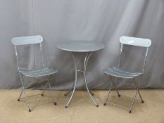 A metal garden table, diameter 60cm and two chairs
