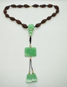 19thC Chinese necklace made up carved nuts, each one depicting a scholar carrying out a daily