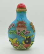 Chinese glass perfume bottle decorated in overlaid design of underwater creatures on blue ground,