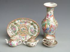 Six Chinese Canton famille rose items comprising a vase of baluster form, two small teapots, a