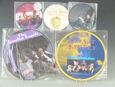 Over 40 7 inch and 12 inch picture discs including Madness, Comsat Angels, Lotus Eaters, Kissing the