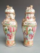 A pair of 19thC Chinese Canton famille rose covered vases of baluster form with figural court