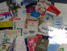 A collection of sporting programmes and photographs including 1948 Olympics, Harlem Globetrotters,