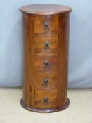 An Eastern hardwood circular chest of five drawers, diameter 35cm, H76cm
