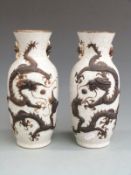 Pair of 19th/20thC Chinese crackle glazed vases with applied dragon decoration and seal mark to