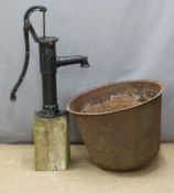 A cast iron garden pump, height 100cm, and a cast iron cauldron