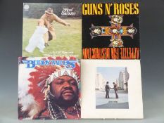 Approximately 100 albums including Guns 'n' Roses, Rod Stewart, Buddy Holly, U2 etc