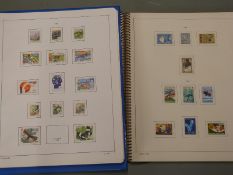 An extensive collection of Finland stamps in five stockbooks and albums