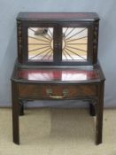 A 19th century low side cabinet with mirrored front, leather inset top and single drawer, W56 x