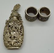 Chinese white metal snuff bottle on chain with four character mark to base and clip with fish and