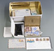 A tin of stamps including stockcards, covers, Coronation omnibus stamps and a Marley Bright