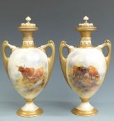 Royal Worcester pair of pedestal twin handled covered vases decorated with Highland cattle in