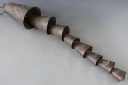 Tibetan/Chinese eight section bell with relief decoration of elephants, height 83cm