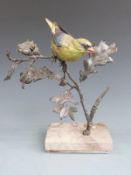 Albany Fine China, Worcester bronze and porcelain figure of a greenfinch raised on a marble base,