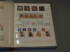 An album of GB QEII mint stamps, presentation packs etc