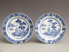 Near pair of 19thC Chinese export plates decorated with a figure on the shore with fishing boats,