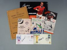 A collection of mainly Manchester United related memorabilia comprising Bobby Charlton signed The