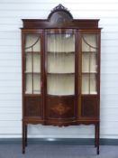 Late 19th or early 20thC bow fronted glazed display cabinet with inlaid decoration W110 x D42 x