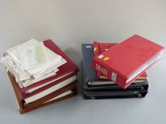 A collection of Guernsey mint stamps 1941-2005 in three albums, two albums of used stamps, three