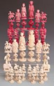 19thC Chinese ivory puzzleball chess set in mahogany box, height of king 17cm, pawns 8.5cm
