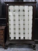 A 19th / 20thC mahogany bevelled glass cabinet with provision for adjustable shelves, raised on ball