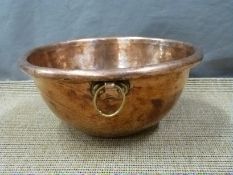 A 19thC copper mixing bowl with brass suspension loop, diameter 28.5cm