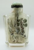 A Chinese reverse painted glass scent bottle with a jadeite cabochon to the stopper, 8.5cm tall